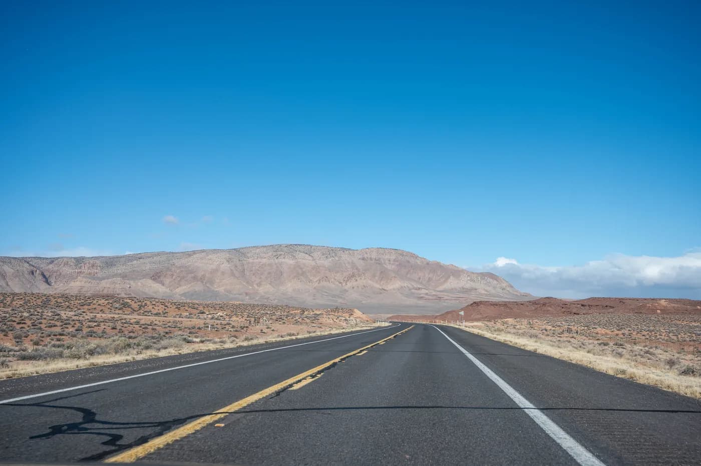 Open road through a desert landscape